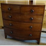 An early Victorian mahogany bow fronted Chest of three long and two short graduated drawers with