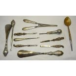 A silver Parasol Handle, various silver handled manicure implements, button hook, two shoe horns