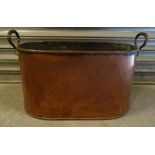 A large two handled oval copper Cooking Vessel. 21" (53cms) wide.