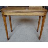 A Regency mahogany Tea Table with 'D' shape fold over top, line inlaid decoration on square tapering