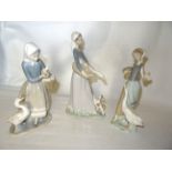 A Lladro Figure of a girl with ducks another feeding a goose and one other Lladro figure.