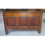 An 18th Century design oak Coffer with plain hinged lid, triple panel front, on stile supports. 3'