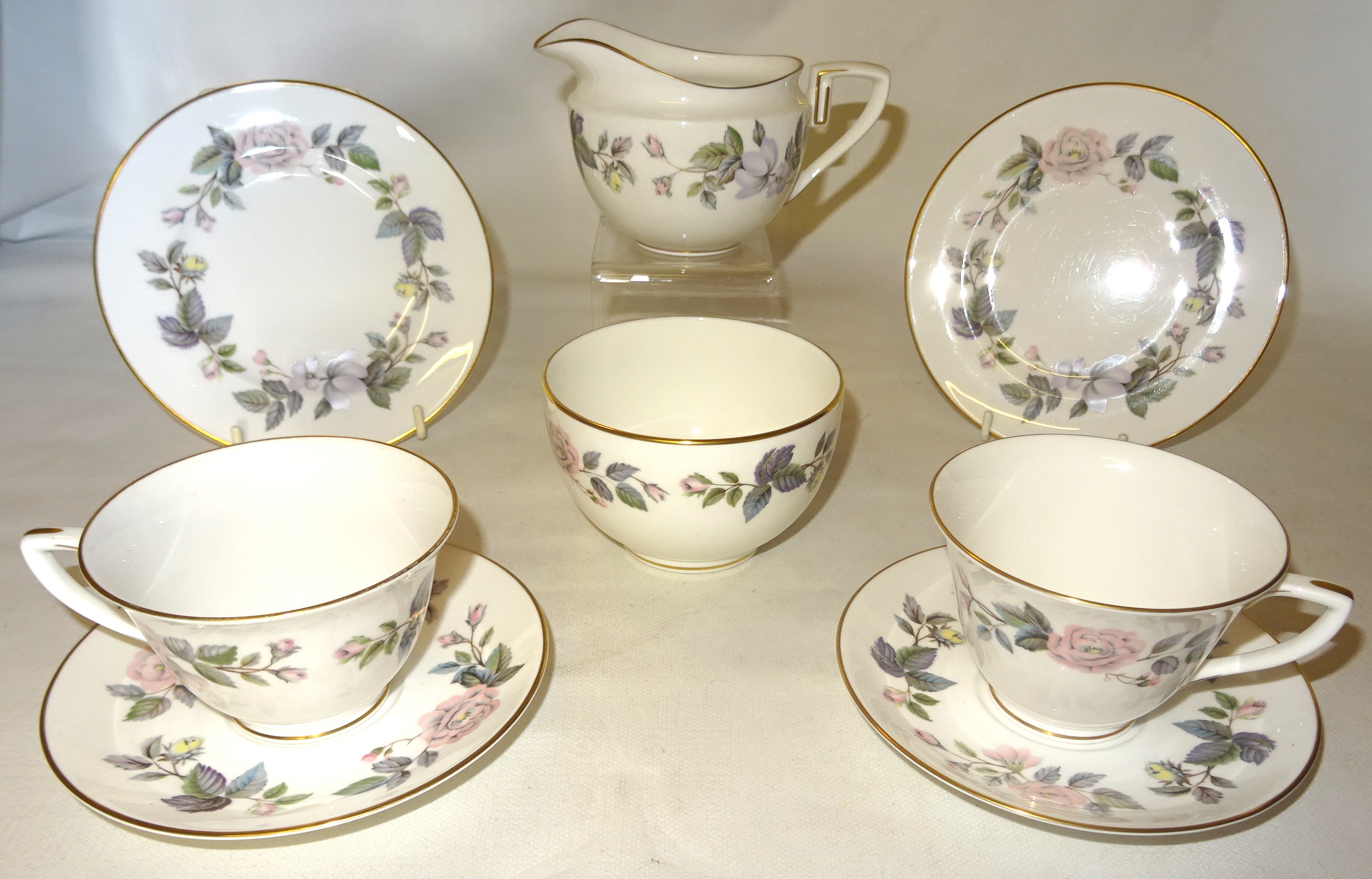 A Royal Worcester June Garland pattern Tea set comprising eight cups, nine saucers, eight plates,