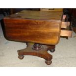A low Victorian mahogany Sewing Table with two frieze drawers, dummy drawers to the reverse and drop