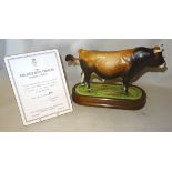 A Royal Worcester Model of a Jersey Bull modeled by Doris Lindner with wooden plinth, No. 402/500