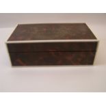 A tortoise shell and ivory bordered Cigarette Box with divided interior. 7" (18cms) long.