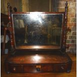 A mid 19th Century oblong swing Toilet Mirror in mahogany frame and on three drawer stand, with