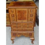 A 20th Century walnut Collector's Cabinet inset with burr walnut panels, fitted with a centre