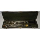 An Oboe by Hawkes & Sons, in original wooden case.