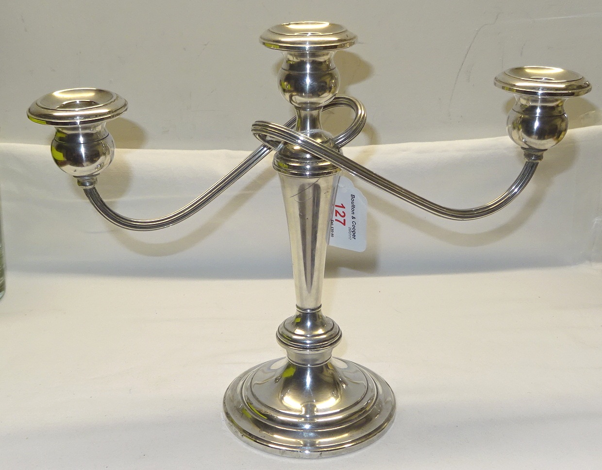 An American sterling silver three light Table Candelabrum on a circular base by Gorham. 10" (