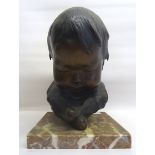 A bronze Study of a baby's head inscribed with initials 'G R' and on a marble plinth. 9" (23cms)