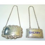 A silver and blue enamel Decanter Label, 'Sherry' and another 'Whisky'.