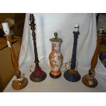 A mahogany fluted column Candlestick Table Lamp, 21" (53cms) high, another, a pair of similar