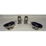 A pair of silver oblong Salts with spoons and blue glass liners on pedestal feet and a pair of