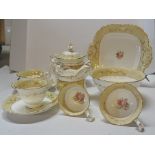 A Victorian Tea Set decorated with floral sprays within a cream and gilt border, comprising six