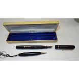 A Mabie Todd self filling Fountain Pen in black case and a propelling pencil.