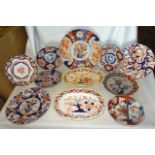 An Imari pattern Plate decorated in orange and blue, 12" (31cms) diameter, five other Japanese