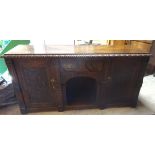 A late 19th Century Continental oak Sideboard with carved border, single centre drawer above an open