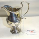 A late Victorian silver baluster Cream Jug with embossed decoration and loop handle, London, 1898,