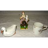 A Bloor Derby figure seated in a chair holding a dog on a square base, 5" (13cms) high (chair