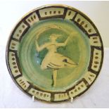 •Quentin Bell (1910-1996); a pottery Plate, painted with a figure of a dancer in green and gold,