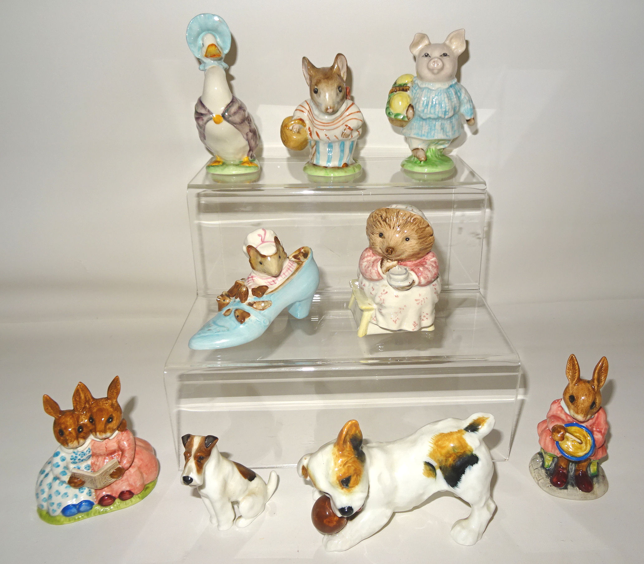 Four Beswick Beatrix Potter figures including Jemima Puddleduck, Mrs Tittlemouse and two others, all