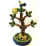 Paul Young; a Studio Pottery Model of a tree with a bird and a lamb at its foot on a circular