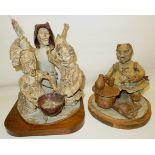 A Studio pottery Sculpture of three witches, 10" (26cms) high and one other.