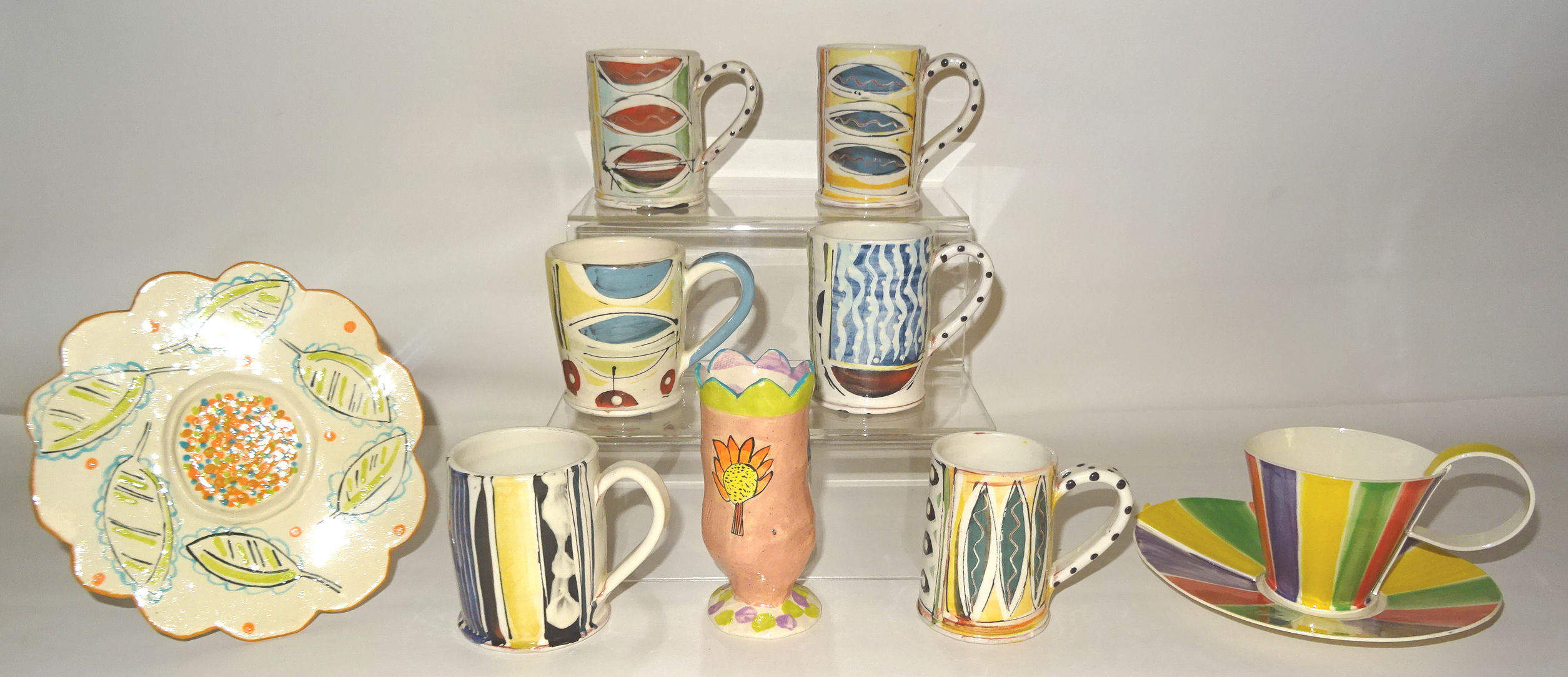 Six Art Pottery Mugs by Irena Sibrijns, a cup and saucer by Jessica Ball, a small vase by Edla