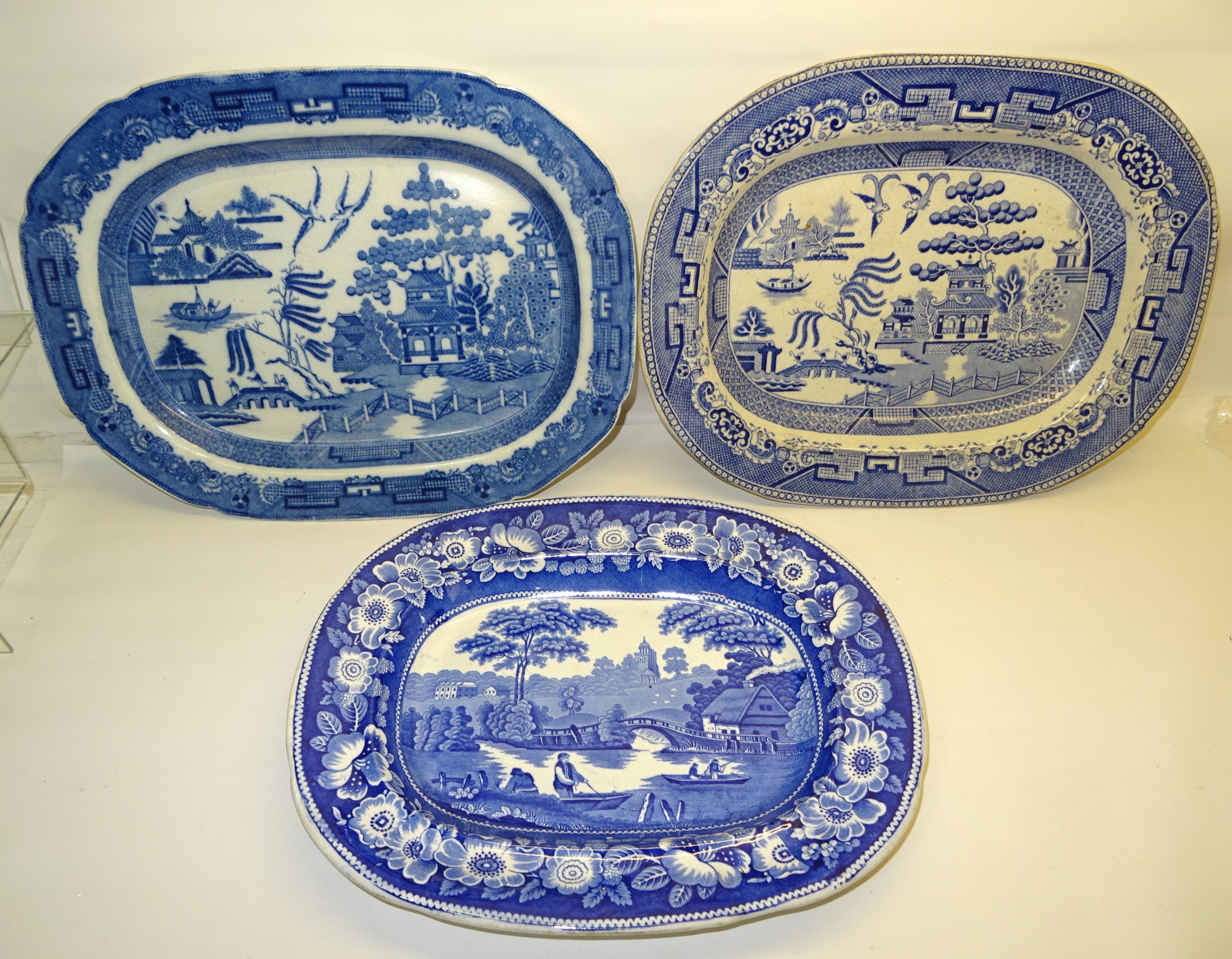 A 19th Century Wild Rose pattern earthenware Meat Plate decorated in blue and white, together with
