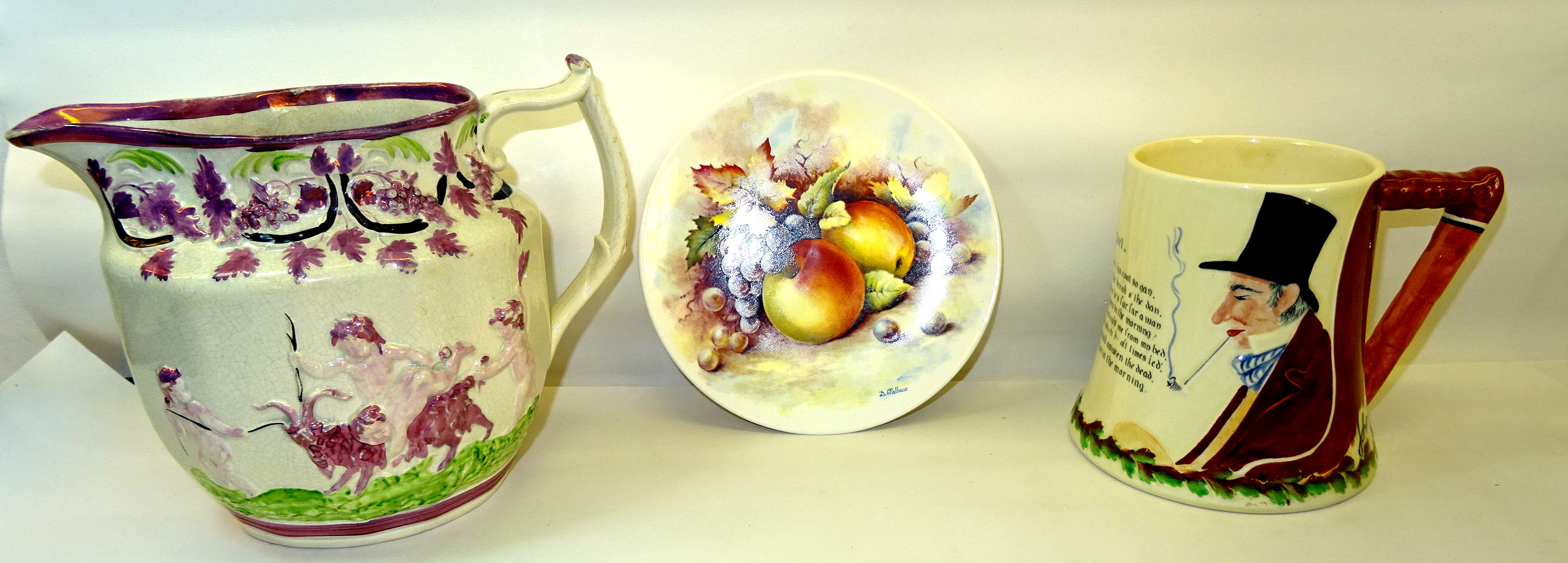 A 19th Century pink lustre Jug decorated with the raised pattern of children playing, a Poole