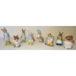 A collection of eight Beswick Beatrix Potter Figures including Mrs Rabbit and Bunnies, Tabitha