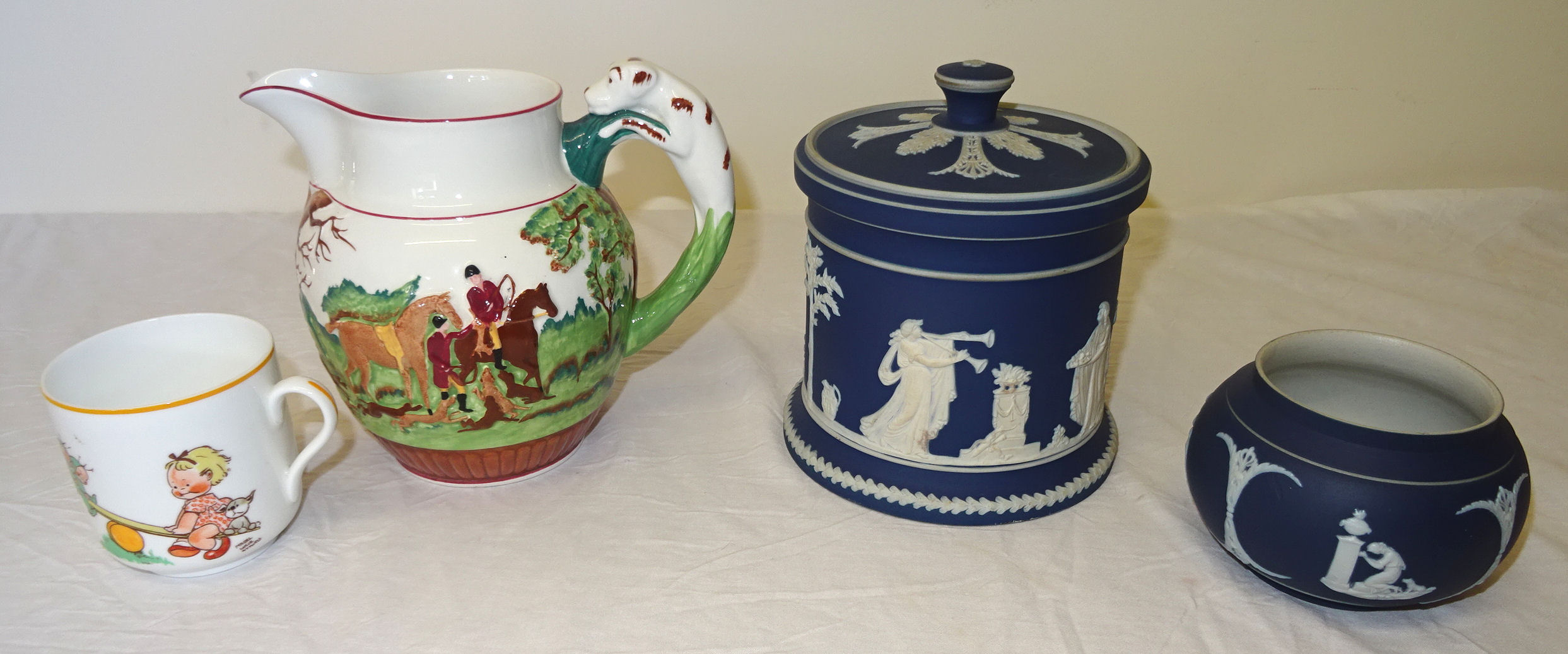 An Adams Ware blue Jasper Ware Biscuit Barrel and cover, a similar bowl, Wedgwood John Peel jug