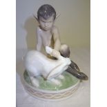 A Royal Copenhagen figure of Faun holding a rabbit, no. 175. 5" (13cms) high.