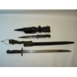 A British 1907 pattern Bayonet by Chapman, marked "1907", with scabbard, and one other Bayonet and