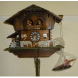 A Bavarian Cuckoo Clock with weight driven movement, and one other.