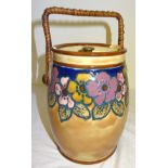 A Royal Doulton Biscuit Barrel and Cover designed by Vera Huggins decorated with stylised flowers