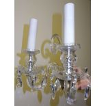 A set of three glass two-branch Wall Lights with scroll branches and hung with button and pear