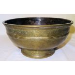 A Chinese brass Bowl engraved with panels of flowers and with a reeded border, 10" (26cms)