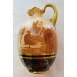 A Doulton Burslem Ewer printed with a scene of Penrhyn Castle with gilt handle, on a blue and gilt