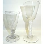 An early 19th Century Wine Glass with bucket shape bowl and cotton twist stem and a glass flute with