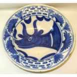 A Continental tin glazed earthenware Bowl decorated in blue and white with a bull's head within a