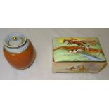 A Fieldings Crown Devon Cigarette Box with musical movement decorated with hunting scenes and a