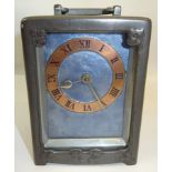 A Liberty & Co pewter Carriage Clock by Archibald Knox numbered 0721 with a copper and blue enamel