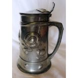 A Liberty Tudric pewter lidded Tankard of Art Nouveau design with raised stylised floral design