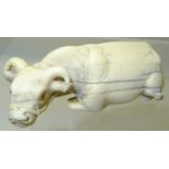 A Japanese Netsuke in the form of a carved ivory water buffalo. 2 1/2" (6 1/2cms) long.