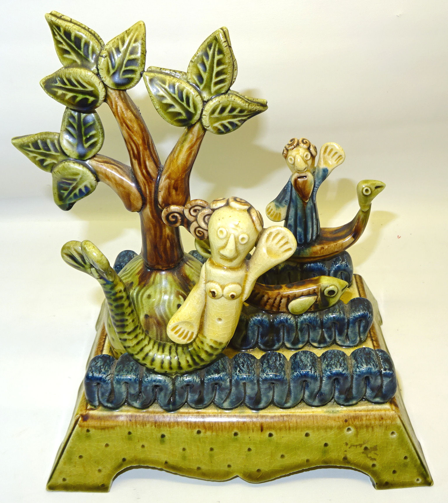 Paul Young, a Studio Pottery Group including a mermaid, fish, trees, etc., on a platform base, 8 1/