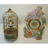 A reproduction Automaton Clock with birds in a bird cage. 6" (15cms) high and a timepiece in a