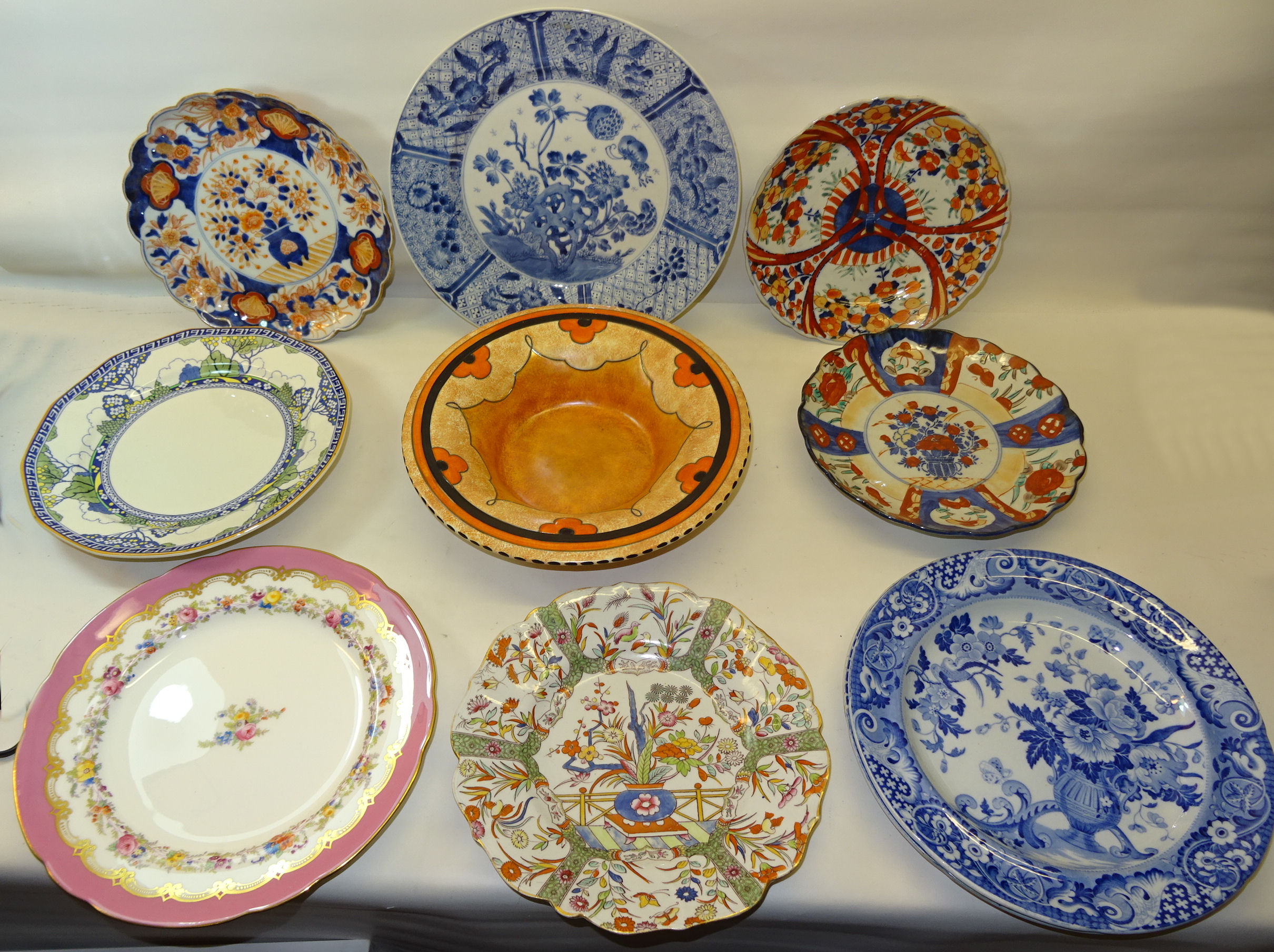 A Burleigh ware tube lined circular Bowl by Harold Bennett with stylised flowers in orange, black,