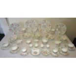 A Minton Haddon Hall pattern Table Service, including plates in various sizes, teacups and